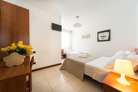 Standard Triple Room | Down comforters, in-room safe, desk, blackout drapes