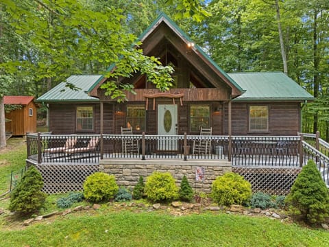 Cozy cabin retreat with spacious wraparound deck and forest views