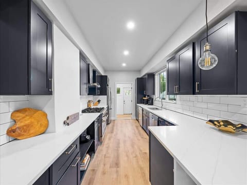 Kitchen, 8 burner stove top and oven, 2 dishwashers 