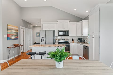 Very light and bright dining area looking into the kitchen.