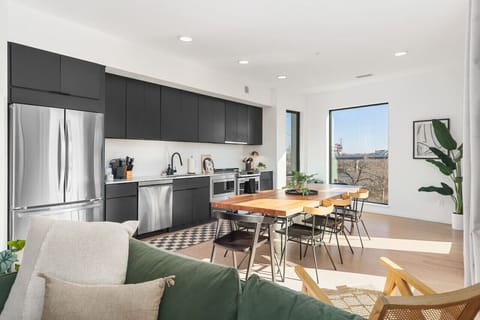 Enjoy your coffee and breakfast around the dining table with seating for 8. We get lots of natural light in the space as this is the top floor penthouse unit.
