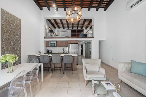 The open concept living spaces with high ceilings.