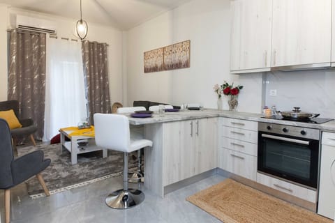 Apartment | Private kitchen | Full-size fridge, oven, toaster, cookware/dishes/utensils