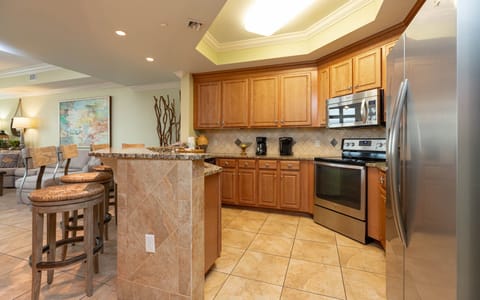 The kitchen features stainless appliances, granite countertops, breakfast bar, Keurig and coffee maker for your favorite cup