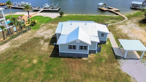 This spacious 3BR/3BA home on Cotton Bayou offers a luxurious pampered experience for up to 14 guests. A private pier and boat slip make it a fisherman's dream.
