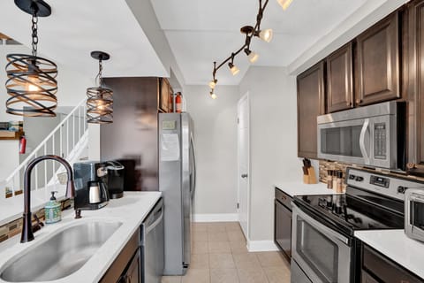 Modern stainless kitchen open to living room