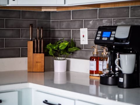 Enjoy the convenience of brewing your favorite blend in our modern coffee maker.