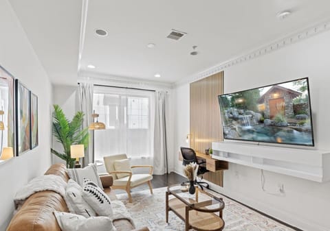 Work and unwind seamlessly in our stylish living room with a dedicated workspace