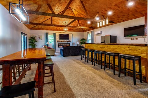 Entertainment room - Relax with a full bar, fireplace, 2 tv's, and dining table.