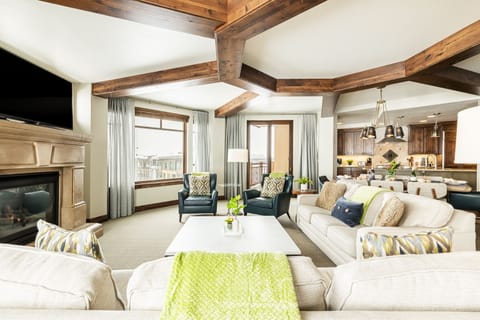 Living room with comfortable furnishings, including a queen sleeper sofa