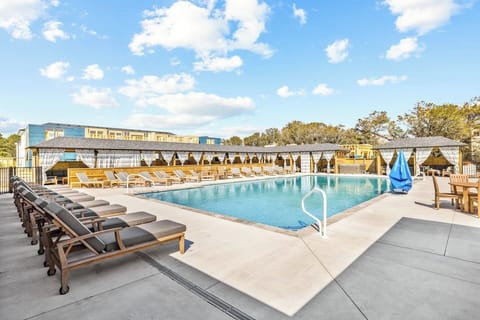 Enjoy access to the beautifully maintained heated community pool, complete with lounge seating and private cabanas available for rent.