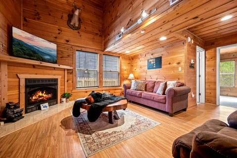 As you step inside the front door, you are immediately welcomed by the high ceilings and rustic cabin feel.