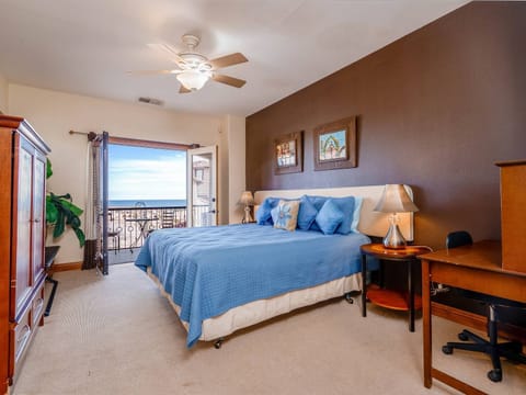 Queen bed with private en suite bathroom — one of three bedrooms in this 3.5-bath vacation rental .