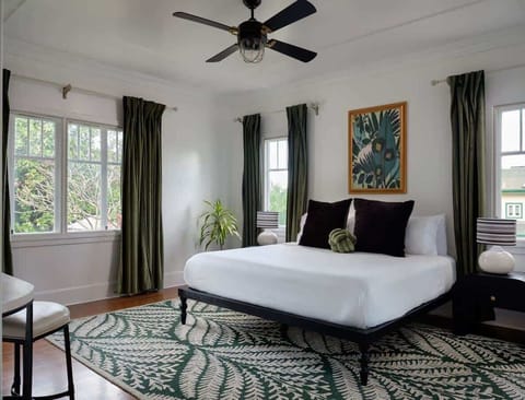Paradise awaits in the Kahili Suite! Wake up to lush garden views & sink into our dreamy bed. Book your tranquil island escape!