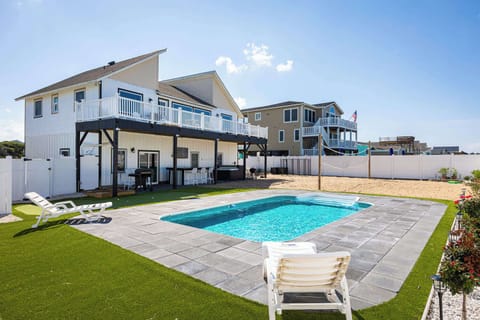 Ground Level: Private pool area with spacious patio, comfortable lounge seating, exclusive outdoor retreat