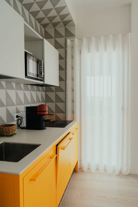 Deluxe Apartment | Private kitchen | Fridge, espresso maker, coffee/tea maker, electric kettle