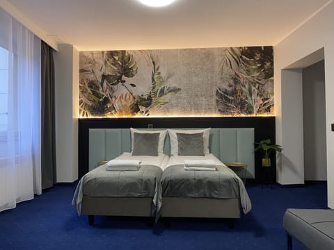 Deluxe Quadruple Room | Hypo-allergenic bedding, individually decorated, desk, laptop workspace