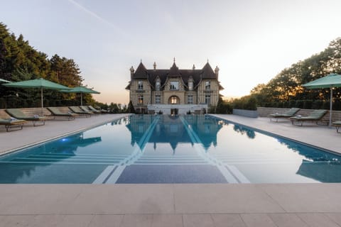 Seasonal outdoor pool, open 8:00 AM to 8:00 PM, pool umbrellas