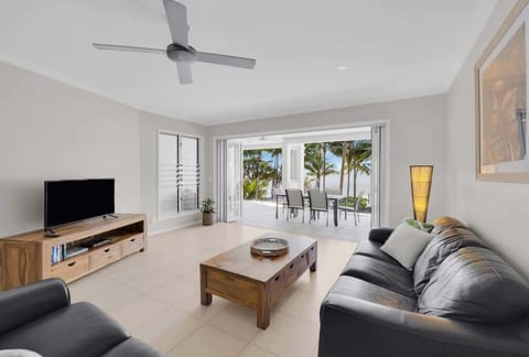 Kick back in air-conditioned comfort on the plush leather lounges in the open living area.