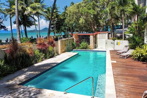 Relish in relaxation by the building's shared, beachfront pool.