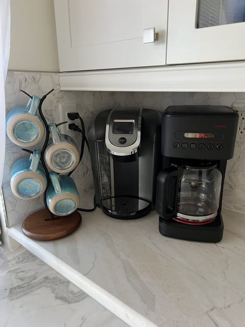 Coffee bar has both a standard coffee pot as well as a Keurig