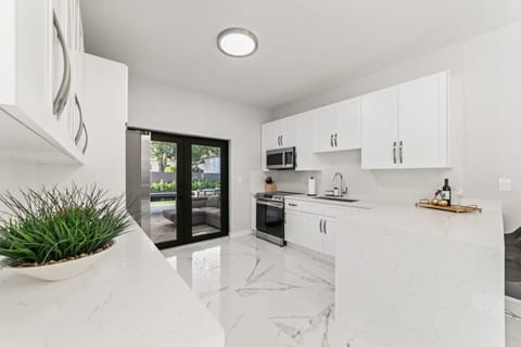 Indulge in the beauty of simplicity in our stunning kitchen oasis. 