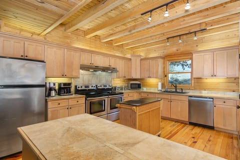 Spacious kitchen with double oven, dishwasher, and drip-style coffeemaker with option for Keurig.