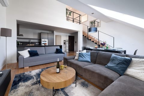 Luxury Apartment | Living area | 16-inch flat-screen TV with cable channels