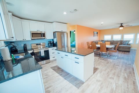 From the entry you can look into the kitchen and over to the living room.