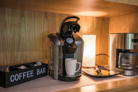 Start your day with a brew! Cozy coffee bar with Keurig & drip coffee maker.
