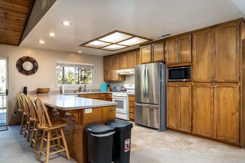 Full kitchen with ample seating at the bar