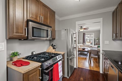 Kitchen with gas stove and full size refrigerator