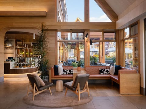 Unwind in an elegant lounge with an open, airy design, where modern touches meet natural elements for a relaxing atmosphere.