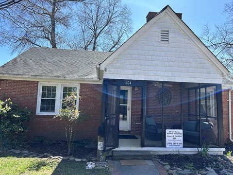 Front of us with a screened in porch.