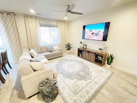 Relax in the living room while watching our 70" TCL smart TV. The sectional offers a queen size pull out bed and bedding is in the tv stand.