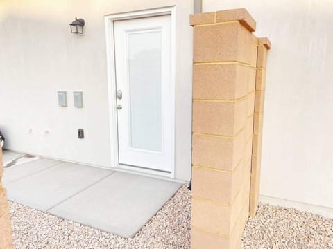 Private entrance behind the 3rd card garage. You will need to walk through the rock path to reach the entrance to the casita which is behind a gate. 