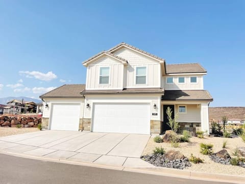The casita is separate from the main house and is behind the single car garage. 