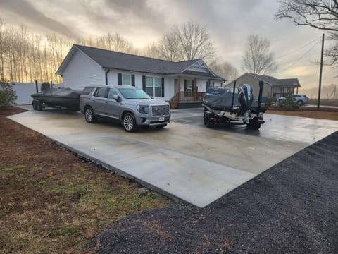 We’ve fit 4 boats 4 trucks and 2 cars on the concrete before.