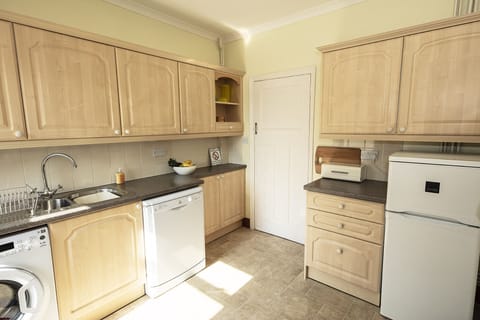 The kitchen with fridge freezer