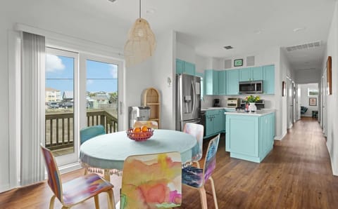 Dining with Balcony Access — Watercolor Chairs & Rattan Pendant Light