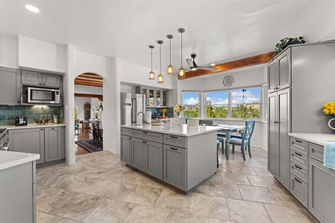 Gourmet kitchen with seating and views