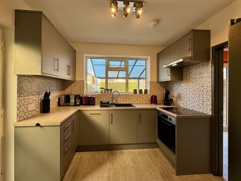 Family House | Private kitchen | Full-size fridge, microwave, oven, dishwasher