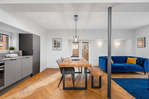 Luxury Apartment, 3 Bedrooms, Patio | Living area | 65-inch Smart TV with cable channels, Netflix, streaming services