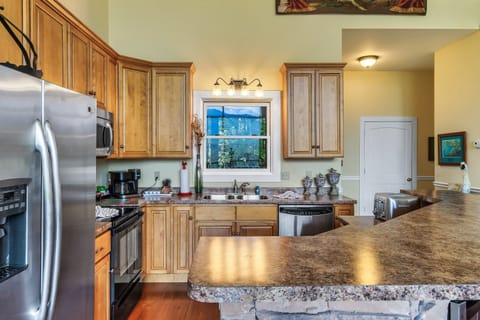 Spacious kitchen with granite counters, modern appliances, and all essentials.