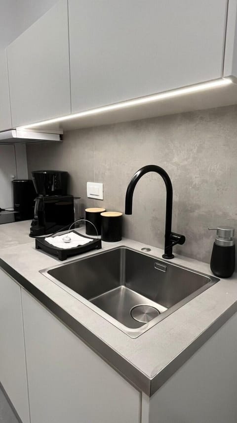 NAIS DOUBLE ROOM BY K&K (Basement - Without Windows) | Private kitchen | Mini-fridge, microwave, stovetop, cookware/dishes/utensils