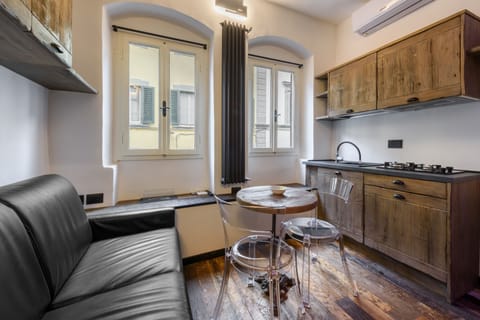 City Apartment | Living area | 40-inch flat-screen TV with digital channels