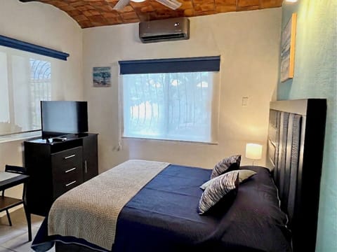 Enjoy this comfortable and cool studio with a queen bed and air conditioning, 