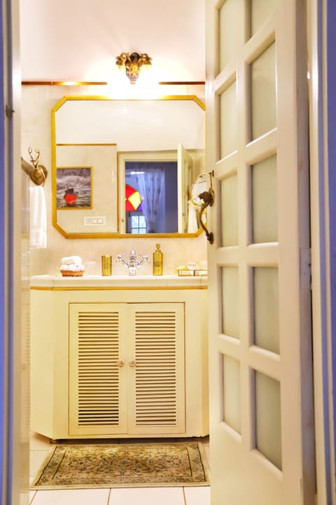 Premier Suite | Bathroom | Rainfall showerhead, designer toiletries, hair dryer, bathrobes