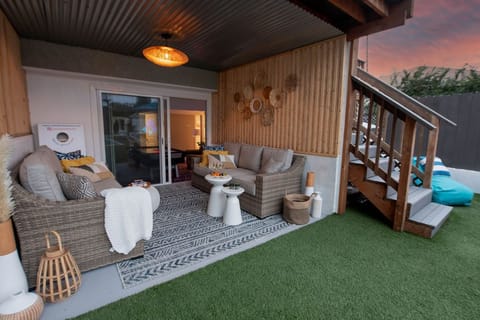 Escape the sun and lounge in the shade of our covered outdoor seating area. The perfect spot for lazy afternoons.