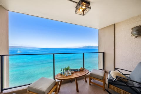Relax on a private balcony overlooking the sparkling Pacific Ocean